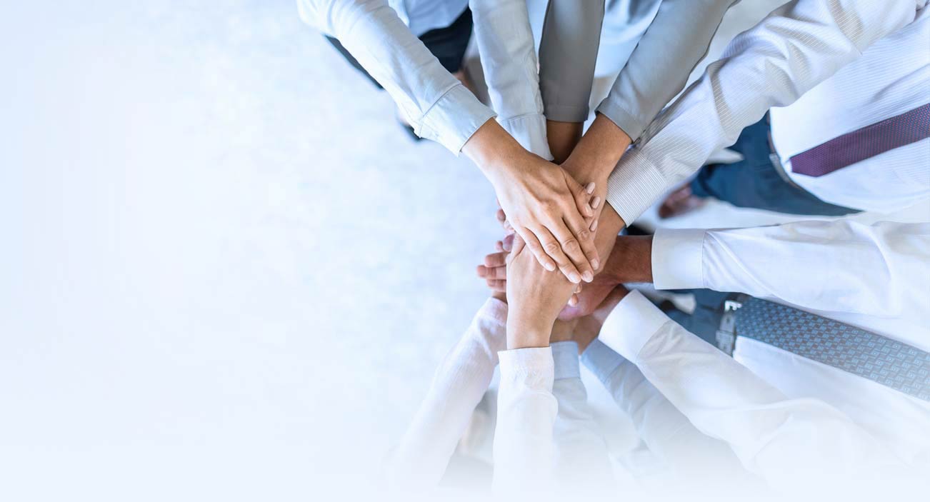 CSO Center Members put hands on top of each other
