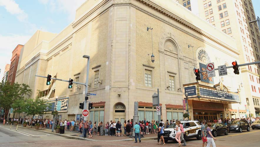 Audience members line up out side the The Benedum Center; part of the Pittsburgh Cultural Trust. The Pittsburgh Cultural Trust recently installed new weapons detection technology which has trimmed wait times and congestion around venue entrances.