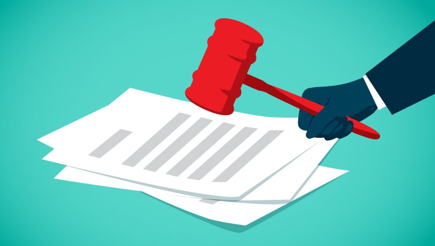 Illustration of a hand holding a gavel over a small stack of legal papers