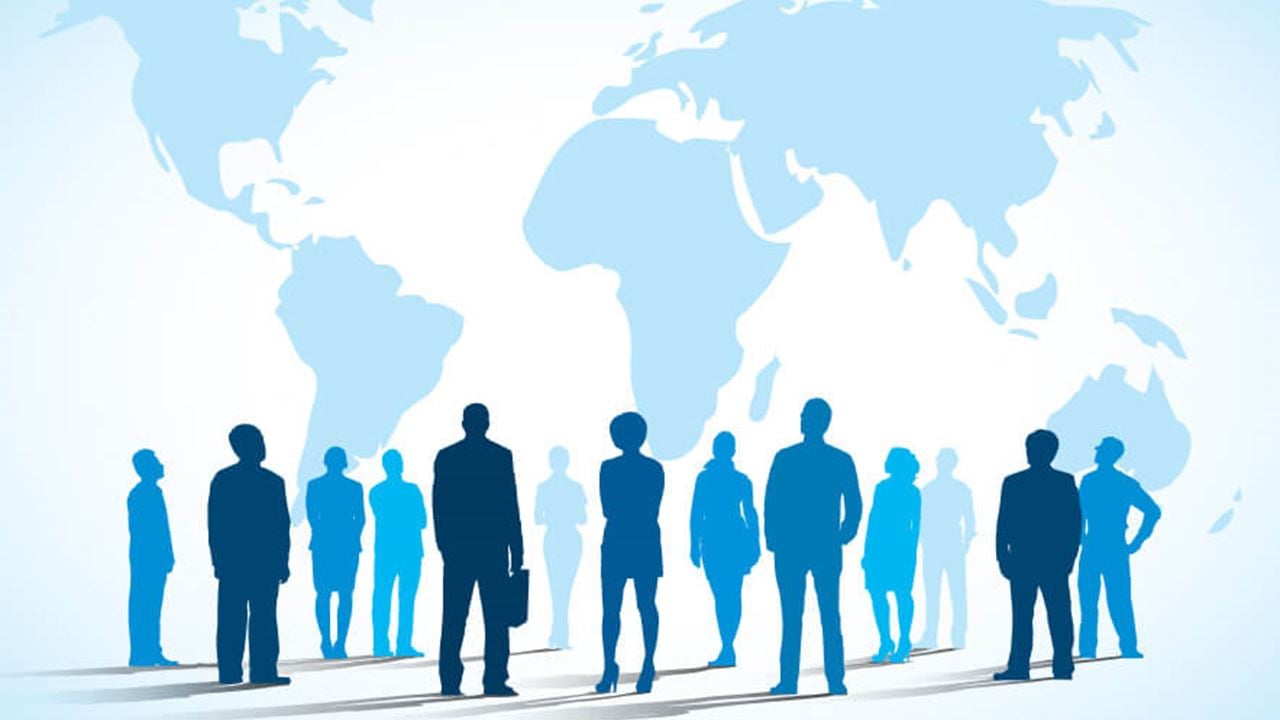 Illustration of a variety of business people's silhouettes in front of a global map