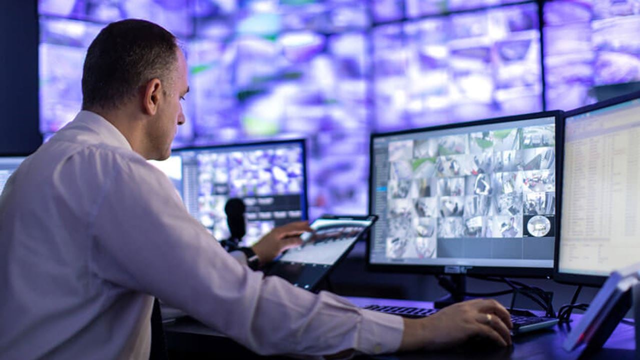 Stock photo of a security analyst at a security operations center desk