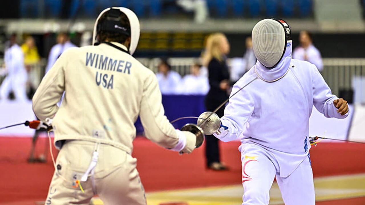 Nathaniel Wimmer (L) of the United States and Simon Renjie Lee (R) of Singapore seen in action during the men's preliminary rounds of the Doha Fencing Grand Prix 2026. (Photo by Noushad Variyattiyakkal/SOPA Images/LightRocket via Getty Images)