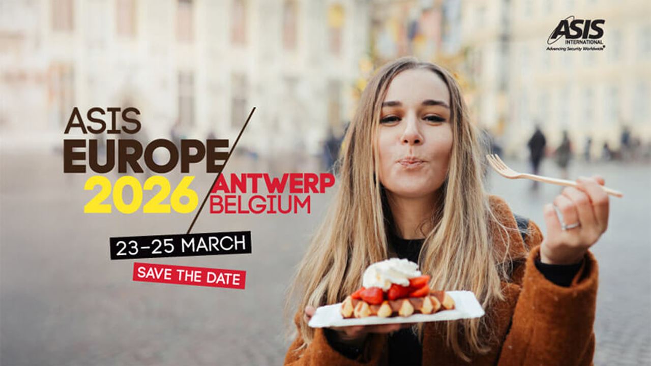 An image of a woman in front of a blurred city background stands holding a waffle with strawberries and chocolate. She has just taken a bite from her food and is smiling with a fork in her other hand. A logo is overlayed on the image saying "ASIS Europe 2026 / Antwerp Belgium, 23-25 March. Save the date."