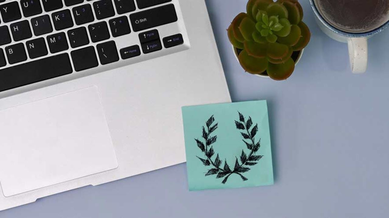 A sticky not on a desk reveals an extremist symbol.