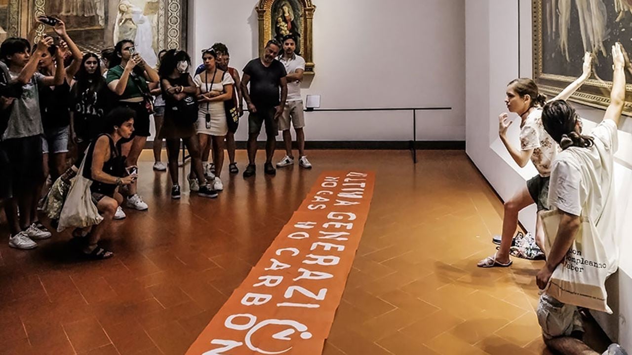 Protesters from the action group Ultima Generazione glue their hands to the glass covering Sandro Botticelli's La Primavera at Uffizi on July 22, 2022 in Florence, Italy.