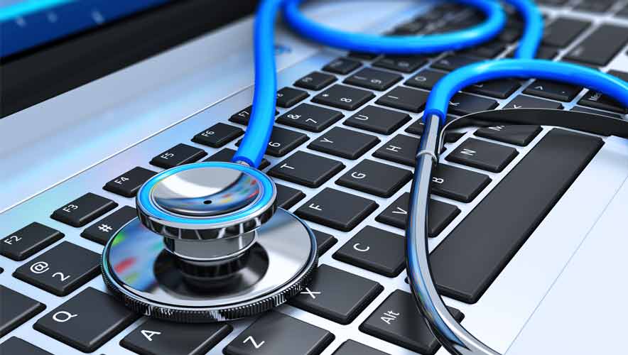 Close up photo of a blue stethoscope on laptop keyboard.