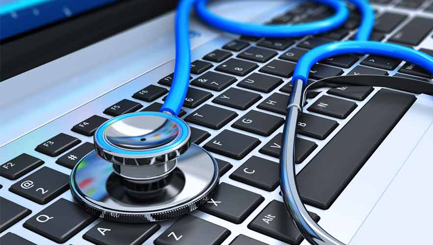 Close up photo of a blue stethoscope on laptop keyboard.
