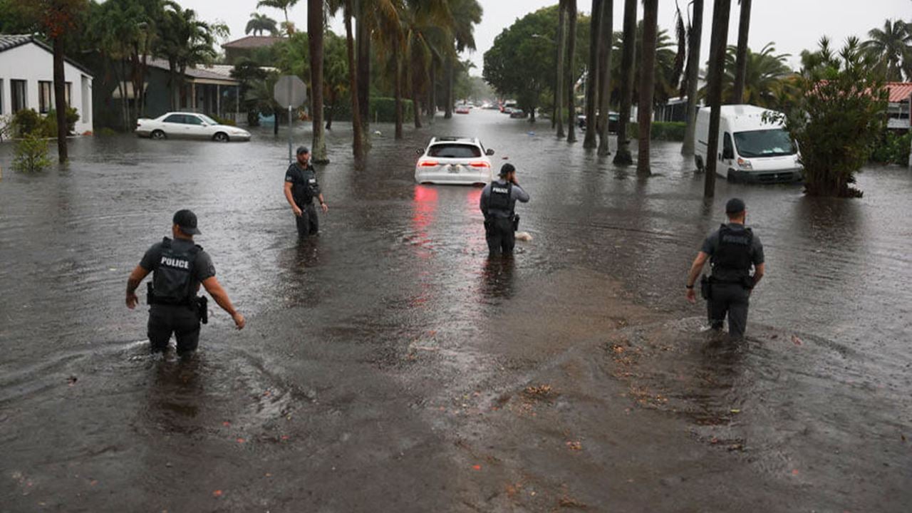 Members of the City of Hollywood SWAT team look for people who may need help being evacuated from a flooded area on June 12, 2024, in Hollywood, Florida.