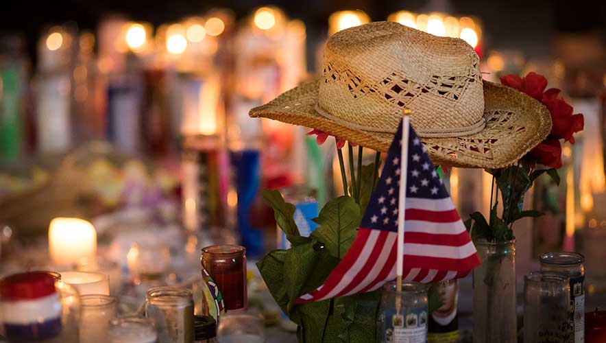 A hat is left at a makeshift memorial during a vigil to mark one week since the mass shooting at the Route 91 Harvest country music festival, on the corner of Sahara Avenue and Las Vegas Boulevard at the north end of the Las Vegas Strip, on October 8, 2017 in Las Vegas, Nevada. On October 1, Stephen Paddock killed 58 people and injured more than 450 after he opened fire on a large crowd at the Route 91 Harvest country music festival. The massacre is one of the deadliest mass shooting events in U.S. history.